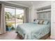 Bright bedroom with a sliding glass door, tile floor, and built-in storage at 4319 Harbor House Dr, Tampa, FL 33615