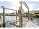 A well maintained private boat lift on a dock ensures easy and secure boat storage for waterfront living at 4319 Harbor House Dr, Tampa, FL 33615