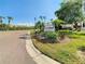 Spinnaker Cove community sign with manicured landscaping near the entrance on a sunny day at 4319 Harbor House Dr, Tampa, FL 33615