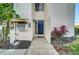 Charming front entryway featuring a blue door, mailbox, and garden plants at 4319 Harbor House Dr, Tampa, FL 33615
