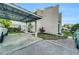 Exterior view of a condo showing the covered carport and landscaping at 4319 Harbor House Dr, Tampa, FL 33615