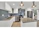 A stylish kitchen features stainless steel appliances, granite countertops, and a functional island, enhancing its appeal at 4319 Harbor House Dr, Tampa, FL 33615
