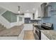 Modern kitchen boasts stainless steel appliances, granite countertops, and a functional layout, steps from the stairs at 4319 Harbor House Dr, Tampa, FL 33615