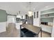 The open-concept kitchen features granite countertops, stainless steel appliances, and a cozy breakfast nook at 4319 Harbor House Dr, Tampa, FL 33615