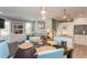 Open living area with a table, accent lighting, tile flooring, and a stairway leading to the upper level at 4319 Harbor House Dr, Tampa, FL 33615