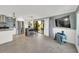 Living area features stainless steel appliances, an island, and a glass slider leading to an outdoor patio at 4319 Harbor House Dr, Tampa, FL 33615