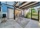 Lovely screened patio featuring stylish chairs, unique ceiling fans and access to the kitchen and backyard at 4319 Harbor House Dr, Tampa, FL 33615