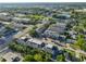 Wide aerial view of the community showing the surroundings, nearby roads, and mature landscaping at 4405 W Fair Oaks Ave # 9, Tampa, FL 33611