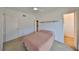 Bright bedroom with ceiling fan, and doors to closet and to hallway at 4405 W Fair Oaks Ave # 9, Tampa, FL 33611