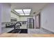 Bright kitchen features stainless steel appliances and a sink with black faucet at 4405 W Fair Oaks Ave # 9, Tampa, FL 33611