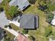 Aerial view of a home and manicured lot, showcasing its roof and proximity to other homes at 4559 Mitcher Rd, New Port Richey, FL 34652