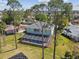 Aerial view of the home showcasing the large backyard and screened pool at 4559 Mitcher Rd, New Port Richey, FL 34652