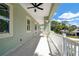 Long outdoor balcony showcasing a sunny day and neighborhood views at 4559 Mitcher Rd, New Port Richey, FL 34652