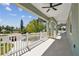 Spacious balcony showcases exterior ceiling fans, and views of the neighborhood at 4559 Mitcher Rd, New Port Richey, FL 34652