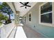 Large balcony with white railings, tiled floor, and views of the neighborhood at 4559 Mitcher Rd, New Port Richey, FL 34652