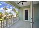 This balcony overlooks a street with palm trees and houses at 4559 Mitcher Rd, New Port Richey, FL 34652