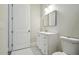 Bathroom with white vanity, modern sink, and a well-lit mirror at 4559 Mitcher Rd, New Port Richey, FL 34652