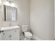 Half bathroom with toilet and sink at 4559 Mitcher Rd, New Port Richey, FL 34652