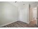 This bedroom features a closet and wood floors at 4559 Mitcher Rd, New Port Richey, FL 34652