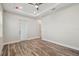 Spacious bedroom features recessed lighting, wood floors, and a glass door at 4559 Mitcher Rd, New Port Richey, FL 34652