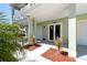 Charming exterior with decorative columns, two garage doors, and well-maintained landscaping at 4559 Mitcher Rd, New Port Richey, FL 34652