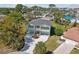 Attractive home with balconies, attached garages, circular driveway, and tasteful landscaping at 4559 Mitcher Rd, New Port Richey, FL 34652