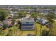 A quiet neighborhood home with a screened pool and palm tree landscaping at 4559 Mitcher Rd, New Port Richey, FL 34652
