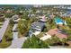 Aerial view of a charming two-story home, landscaped yard, and desirable neighborhood at 4559 Mitcher Rd, New Port Richey, FL 34652