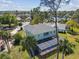 Charming two-story home boasts a screened pool, spacious yard, and desirable neighborhood views at 4559 Mitcher Rd, New Port Richey, FL 34652
