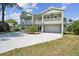 Beautiful two story exterior with two garages, balconies, and a well manicured yard at 4559 Mitcher Rd, New Port Richey, FL 34652