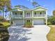 Beautiful two story exterior with two garages, balconies, and a well manicured yard at 4559 Mitcher Rd, New Port Richey, FL 34652