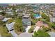Aerial view of a charming two-story home, landscaped yard, and desirable neighborhood at 4559 Mitcher Rd, New Port Richey, FL 34652
