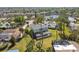 Aerial view of a two-story home boasting a screened pool and desirable neighborhood views at 4559 Mitcher Rd, New Port Richey, FL 34652