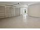Large, empty garage with epoxy flooring at 4559 Mitcher Rd, New Port Richey, FL 34652