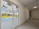 Enclosed patio with sliding glass door overlooking the pool area at 4559 Mitcher Rd, New Port Richey, FL 34652