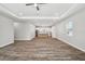 Spacious room with hardwood floors and a combined kitchen/living area at 4559 Mitcher Rd, New Port Richey, FL 34652