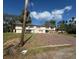 An exterior view of the home shows the structure and surrounding grounds at 4628 Cypress S Way, St Petersburg, FL 33705