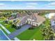 Beautiful home with tile roof, three-car garage, lush landscaping, and water view at 4824 Benito Ct, Bradenton, FL 34211