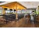 The bar includes dark wood floors, comfortable seating, modern lighting, and views of the lush community at 4824 Benito Ct, Bradenton, FL 34211