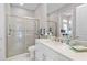 Modern bathroom with glass enclosed shower, white vanity, and bright natural lighting at 4824 Benito Ct, Bradenton, FL 34211