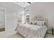 Bright bedroom with plush bedding and neutral tones, connected to the bathroom at 4824 Benito Ct, Bradenton, FL 34211