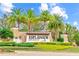 Esplanade Golf & Country Club entrance sign surrounded by lush landscaping and palm trees at 4824 Benito Ct, Bradenton, FL 34211