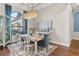 Elegant dining room with modern furniture, a large window, and sophisticated decor at 4824 Benito Ct, Bradenton, FL 34211