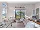 Comfortable living room area with a large window and sliding door looking out to the backyard at 4824 Benito Ct, Bradenton, FL 34211