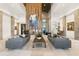 Spacious lobby with modern decor, including a fireplace, comfortable seating, and high ceilings at 4824 Benito Ct, Bradenton, FL 34211