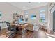 Bright home office with a wooden desk, comfortable seating, and large windows for natural light at 4824 Benito Ct, Bradenton, FL 34211