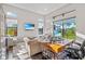 Relaxing home office featuring a comfortable couch, large windows, and a spacious work area at 4824 Benito Ct, Bradenton, FL 34211