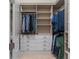 Well-organized walk-in closet with shelving, drawers, and hanging rods for optimal storage and organization at 4824 Benito Ct, Bradenton, FL 34211