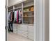 Large walk-in closet offers an ample amount of shelves, hanging racks and dresser drawers at 4824 Benito Ct, Bradenton, FL 34211
