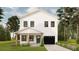Charming two-story home featuring a black garage door, green front door, and a cozy covered porch at 4985 16Th N Ave, St Petersburg, FL 33710